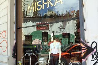 10 Graffiti Street Art Reflected In The Window Of Mishka On Balcarce San Telmo Buenos Aires.jpg
